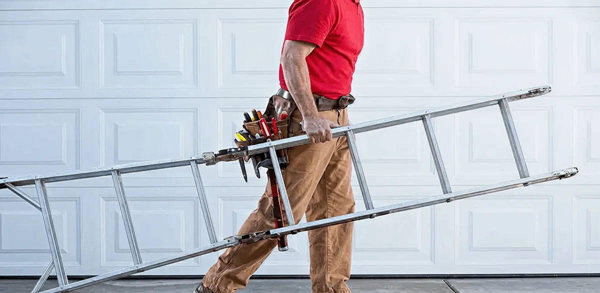 Garage door repair technician arriving with tools and ladder in West Palm Beach, FL